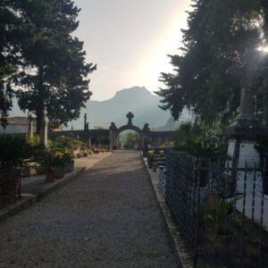 Sóller cemetery mausoleums with Tramuntana mountains backdrop — historical and cultural site